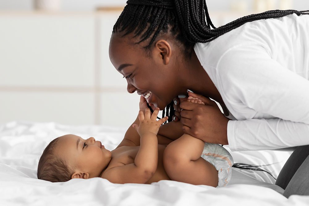 photo of a mom looking at her baby