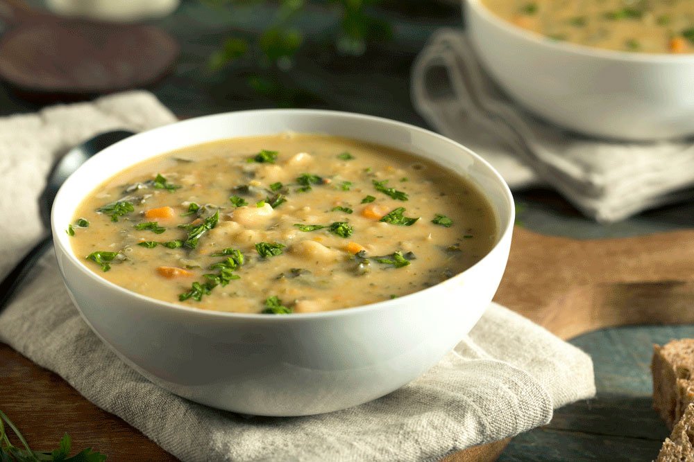 stock photo of a bowl of white bean Tuscan soup