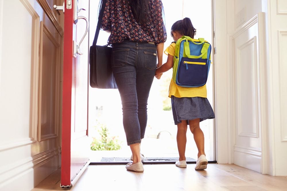 photo of a mom and her daughter working out the door