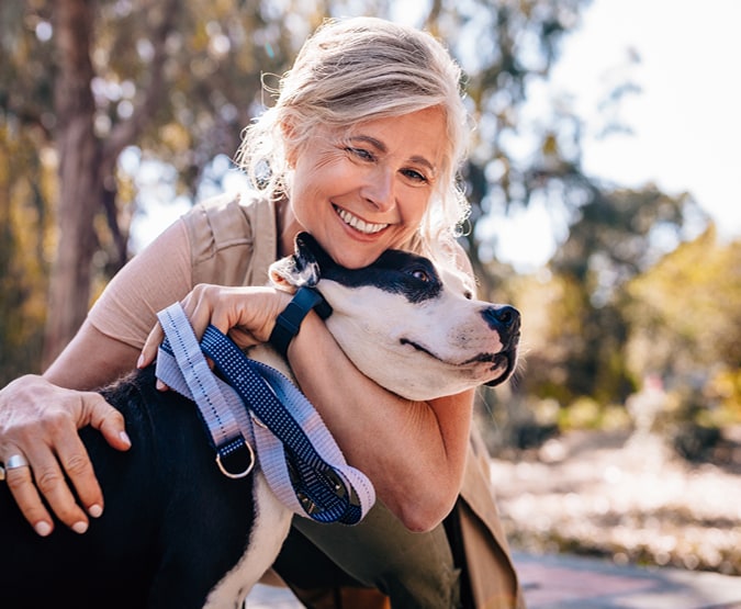 Woman hugging dog