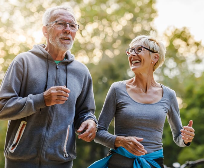 Older couple jogging