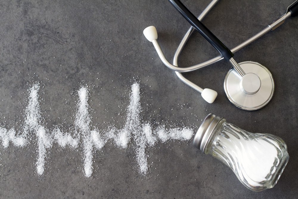 stock photo of a stethoscope and bottle of salt