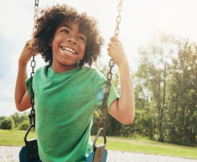 Young boy on swing