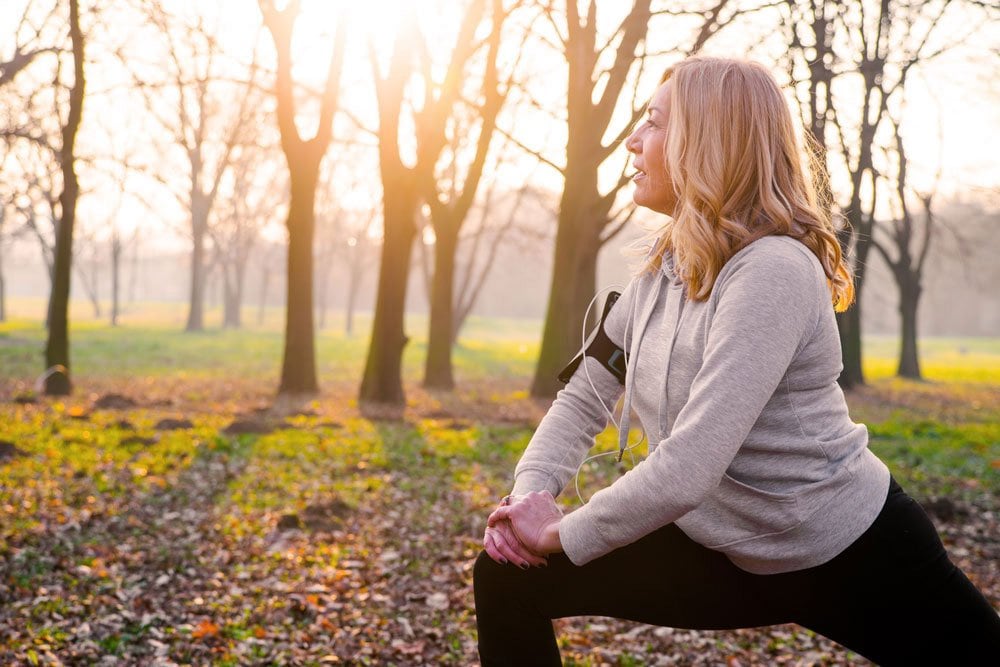 photo of a woman doing warmup outdoor