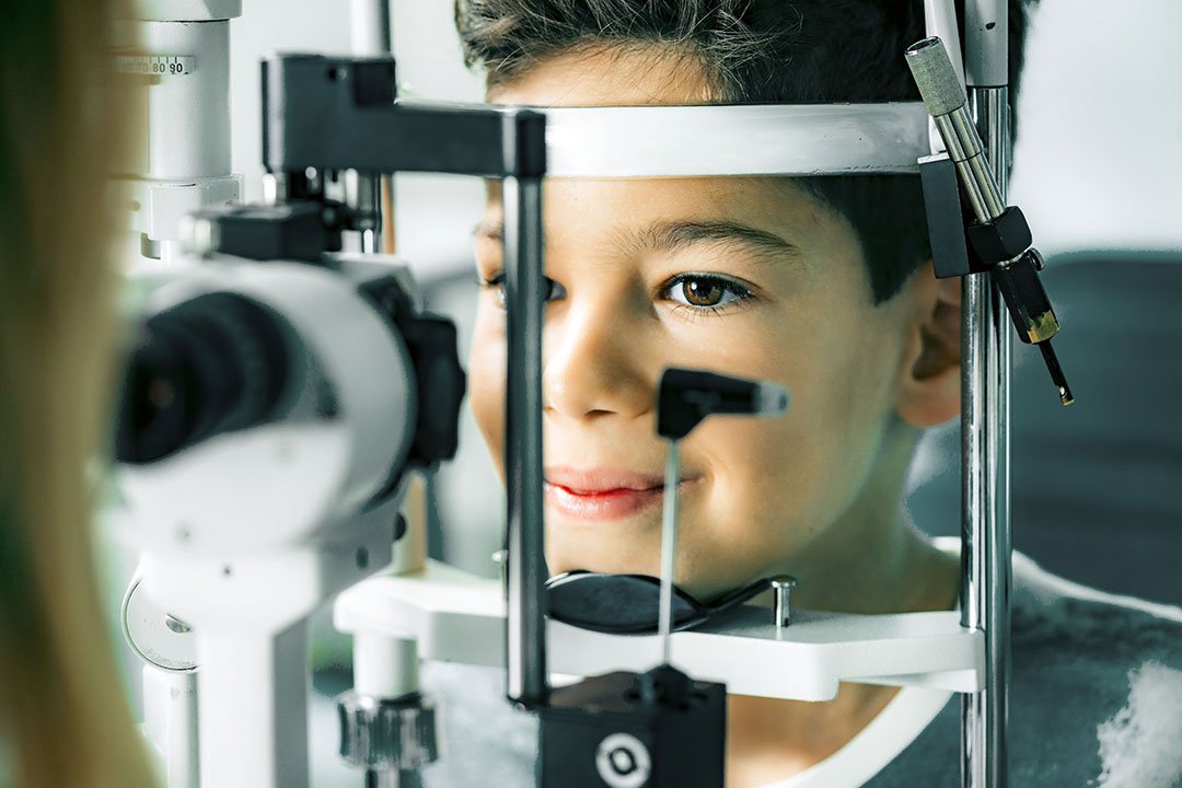 photo of a child getting eye exam