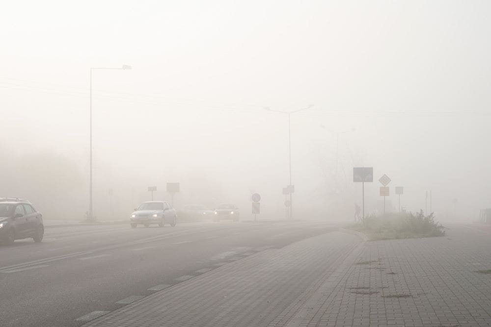 photo of a city road with thick smug