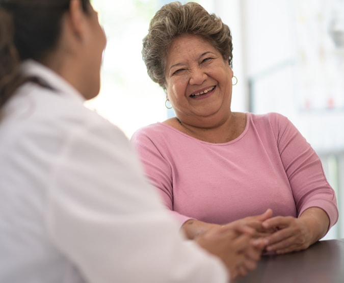 Woman talking to doctor