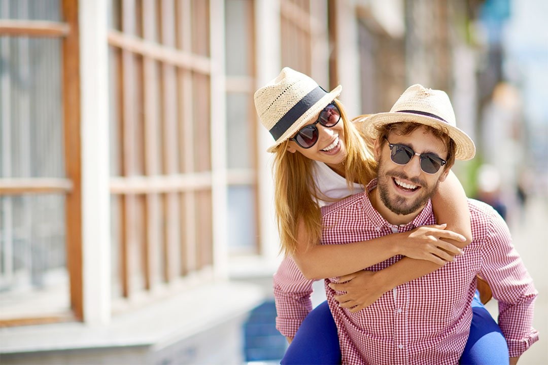 photo of a young couple with sun glasses on