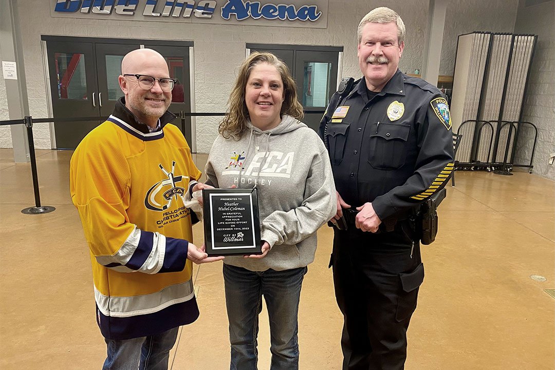 photo of Rehn, Hubel-Coleman, and Police Chief, Jim Felt, with Heather's Life Saving Award on Feb. 13