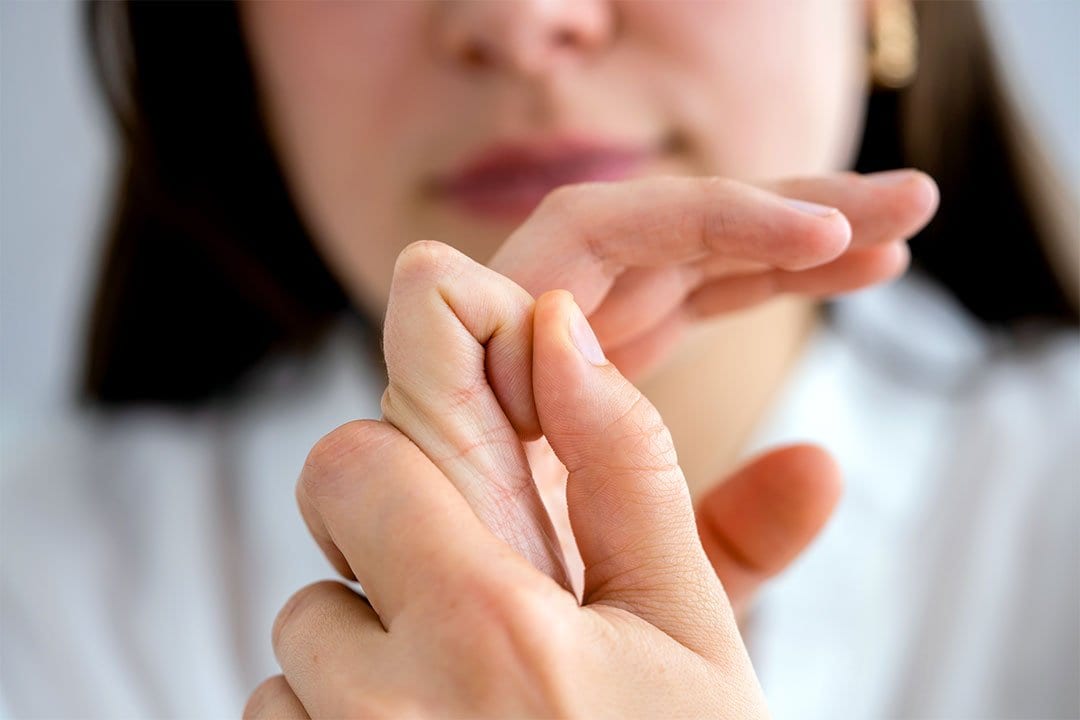 photo of a woman cracking her knuckle