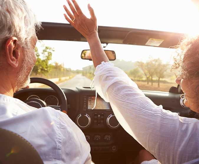 Older couple in convertible