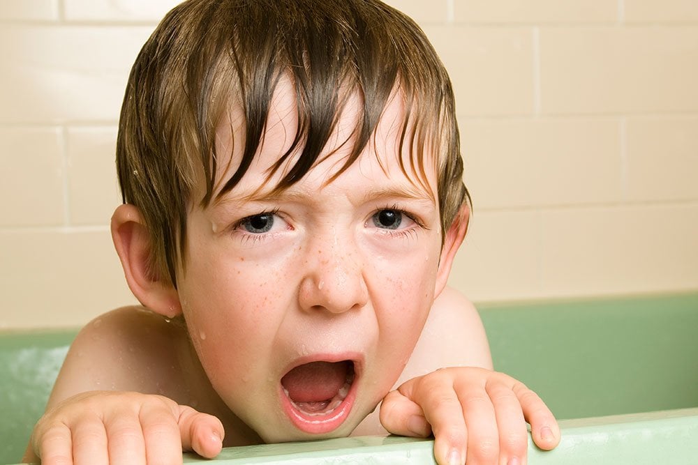 photo of a young boy in the bathtub