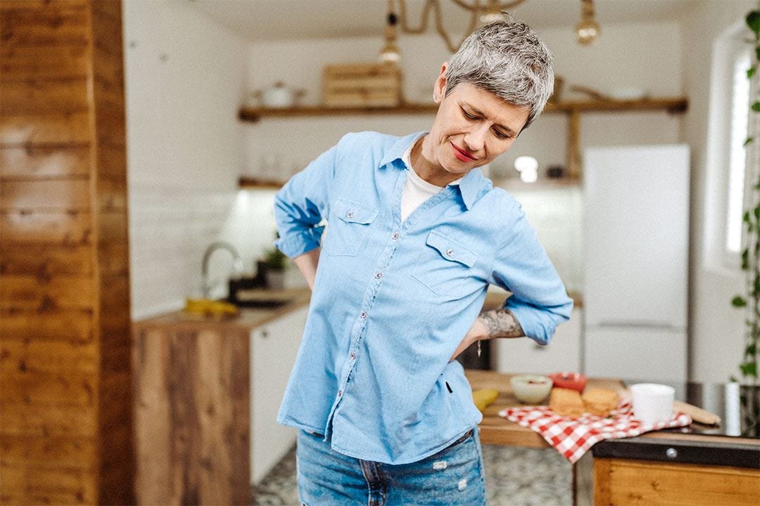 photo of a woman stretching in the kitchen